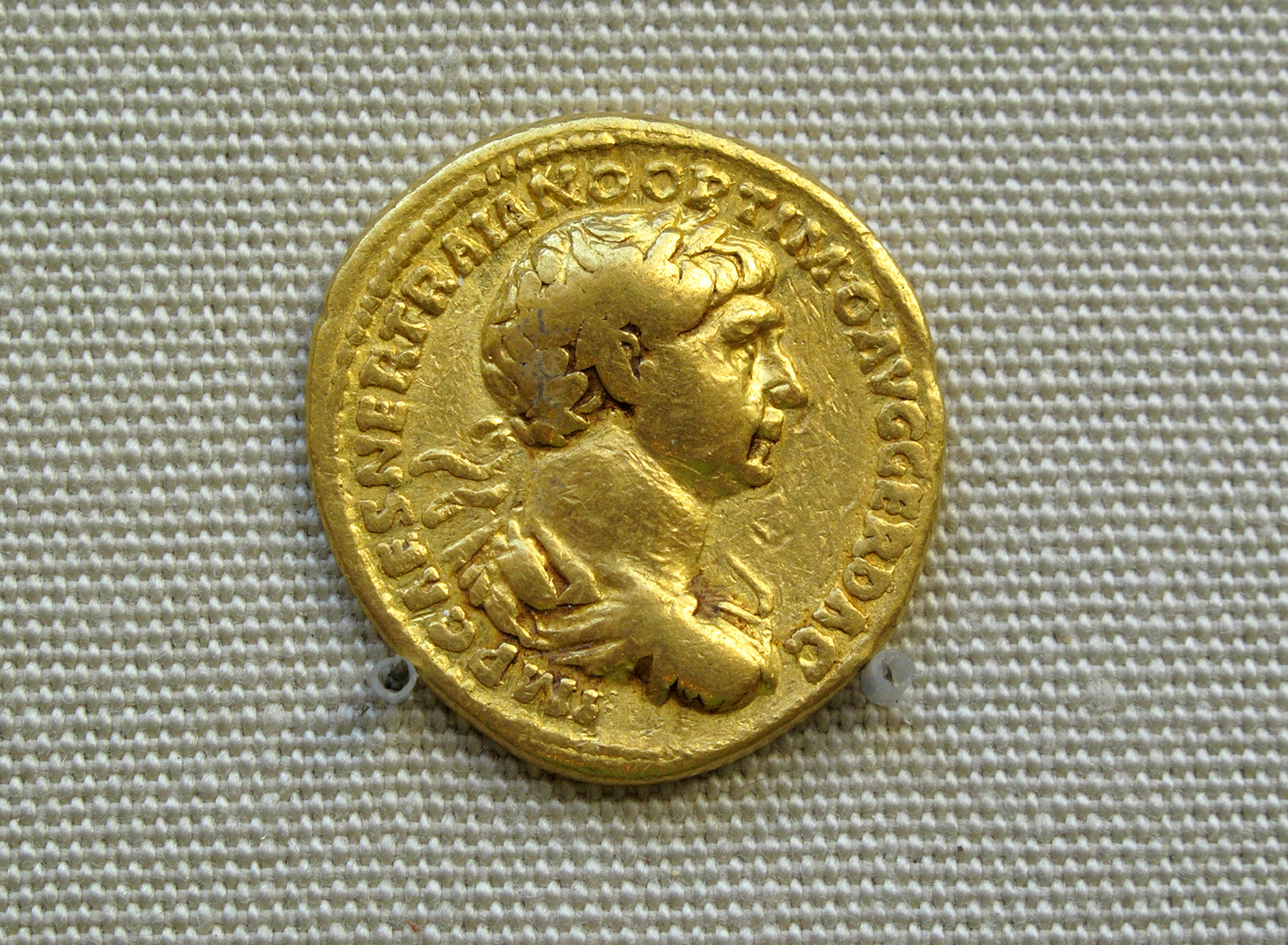 Gold Roman aureus coin of Roman emperor Trajan. Photo courtesy of DollarPhotoClub.com