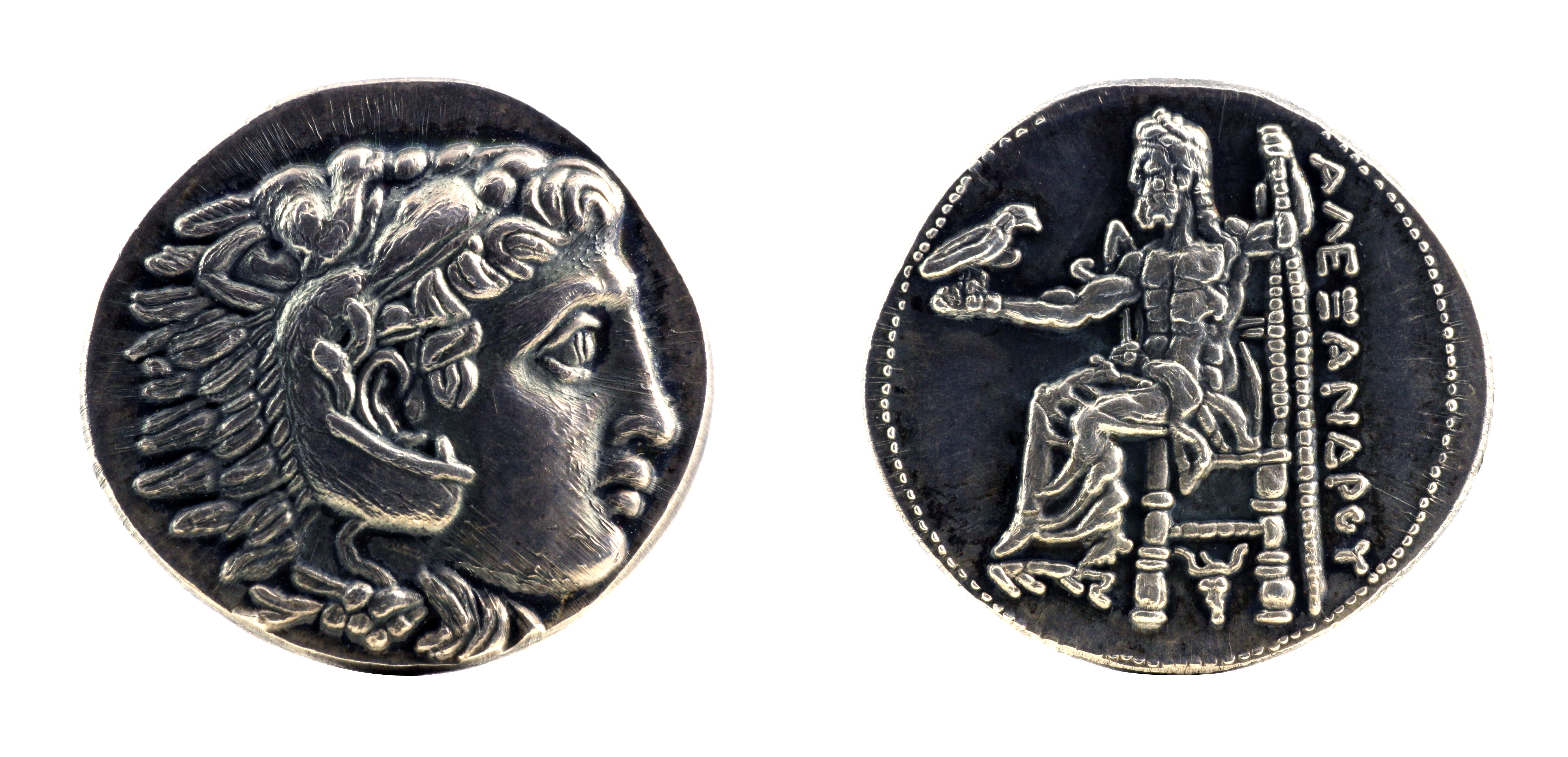Greek silver tetradrachm from Alexander the Great showing Hercules wearing lion skin at obverse and Zeus at reverse, dated 323-315 BC. Image courtesy Adobe Stock.